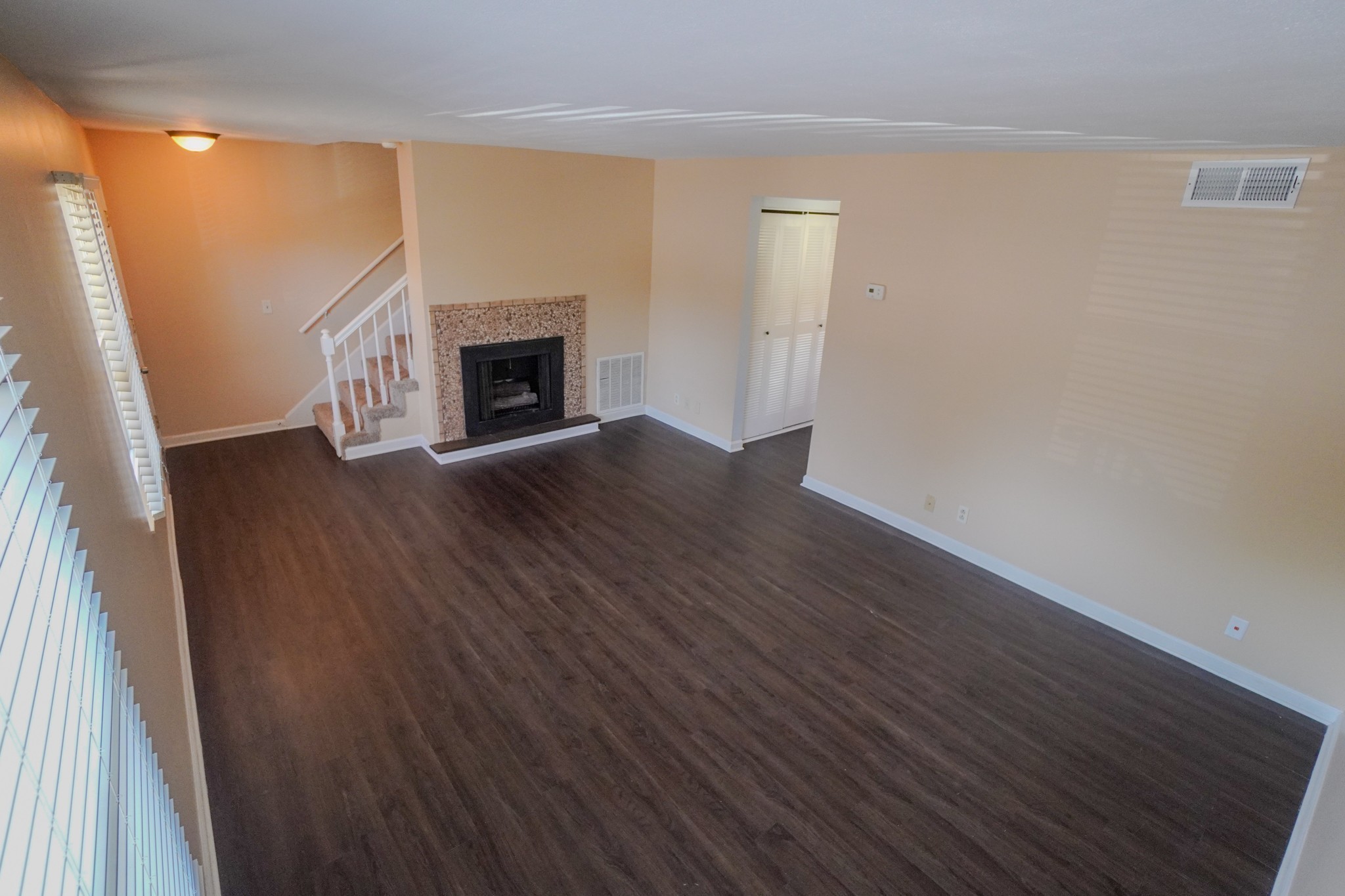 4000 Anderson Road, Unit 44 Nashville, TN 37217 - Photo 16 of 78 a view of empty room with wooden floor and fireplace