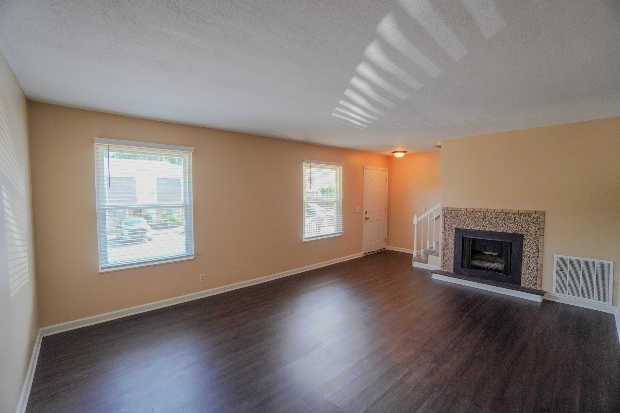 4000 Anderson Road, Unit 44 Nashville, TN 37217 - Photo 17 of 78 an empty room with wooden floor fireplace and windows