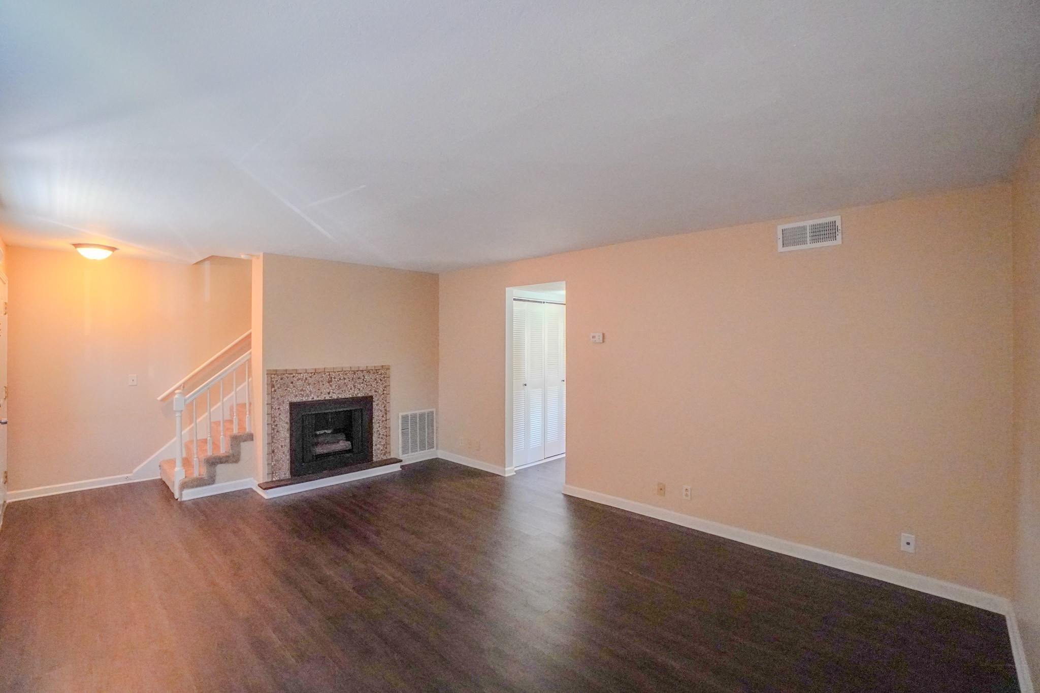 4000 Anderson Road, Unit 44 Nashville, TN 37217 - Photo 20 of 78 a view of empty room with wooden floor and fireplace