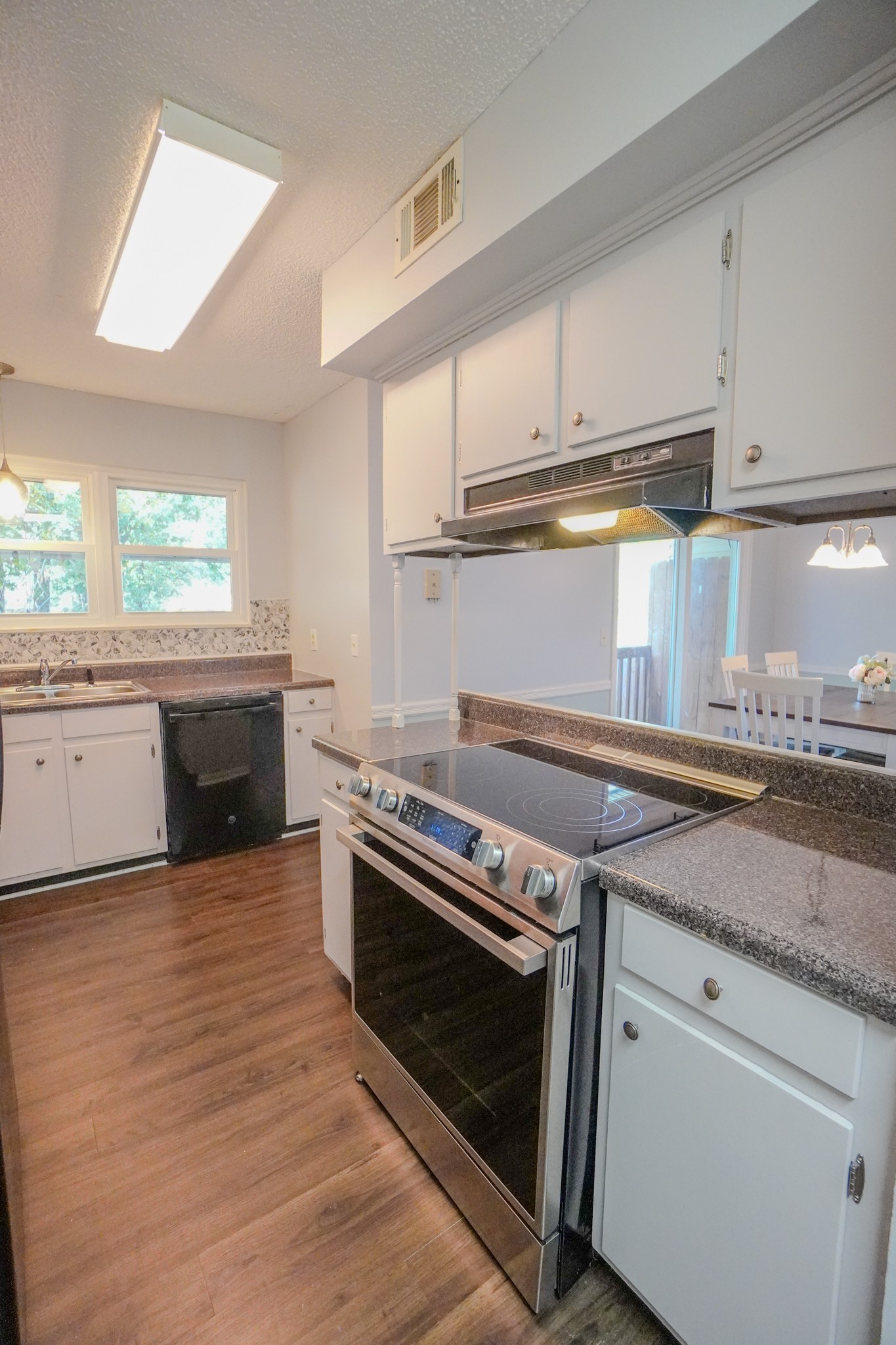 4000 Anderson Road, Unit 44 Nashville, TN 37217 - Photo 31 of 78 a kitchen with granite countertop a stove and a sink