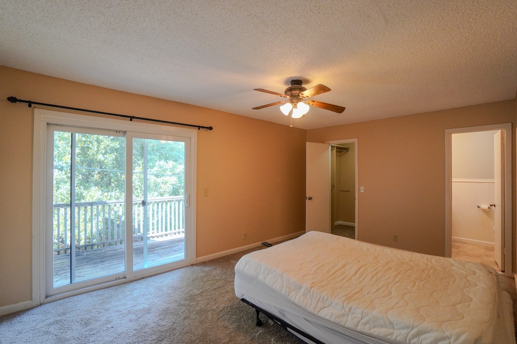 4000 Anderson Road, Unit 44 Nashville, TN 37217 - Photo 37 of 78 a bedroom with a large bed and a chandelier