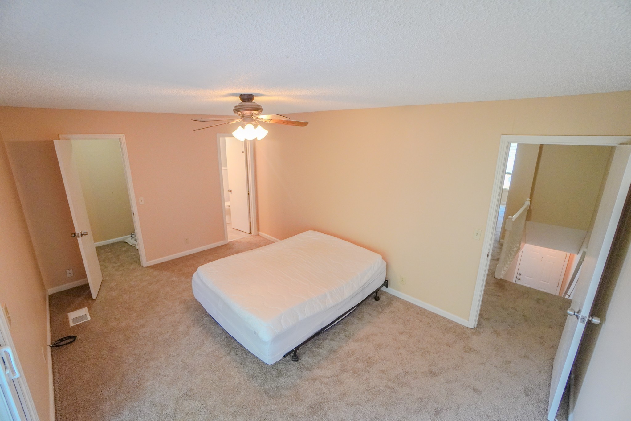 4000 Anderson Road, Unit 44 Nashville, TN 37217 - Photo 40 of 78 a spacious bedroom with a bed and a chandelier