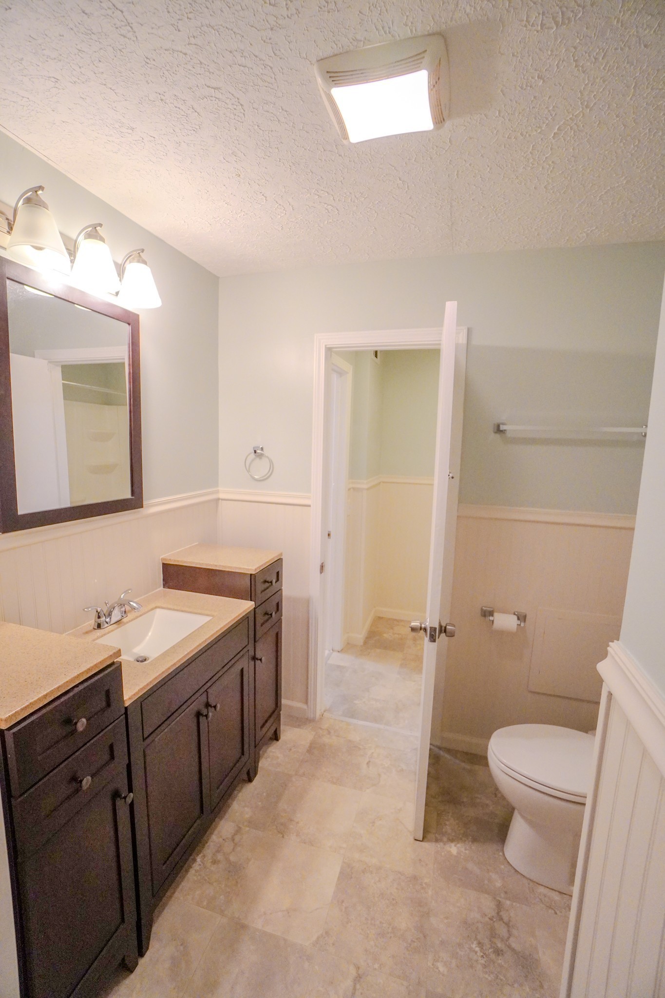 4000 Anderson Road, Unit 44 Nashville, TN 37217 - Photo 45 of 78 a bathroom with a double vanity sink toilet mirror and a bathtub