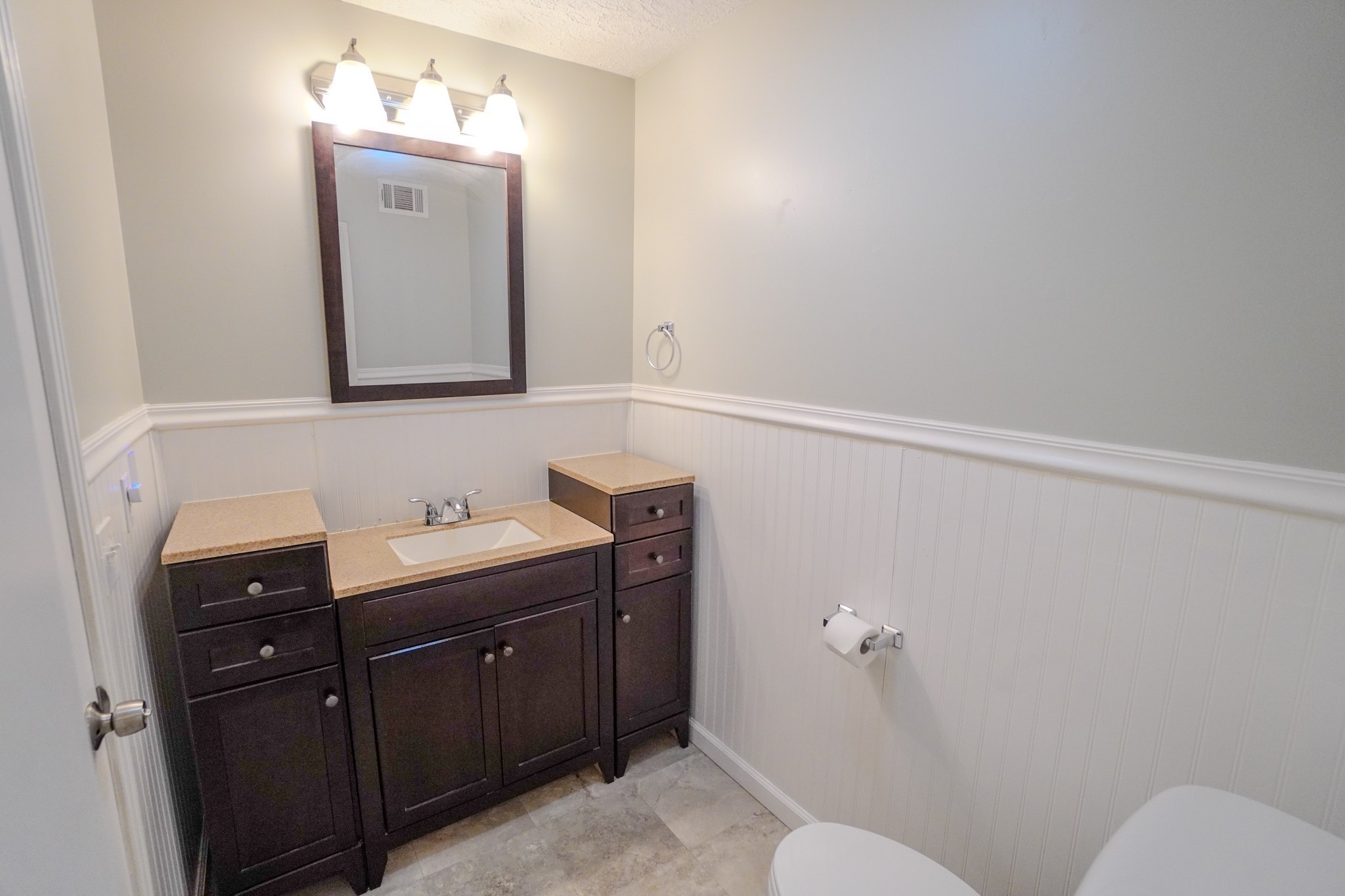 4000 Anderson Road, Unit 44 Nashville, TN 37217 - Photo 50 of 78 a bathroom with a toilet sink vanity and mirror