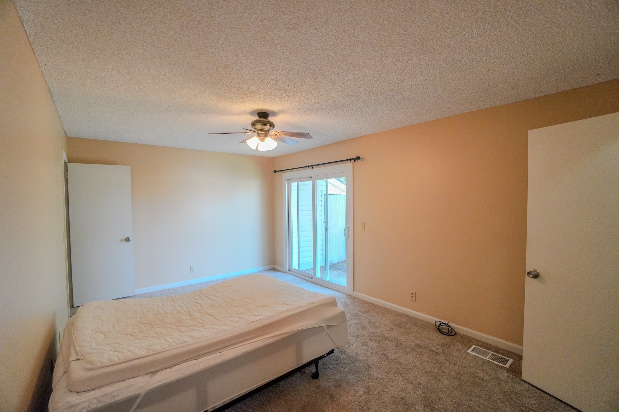 4000 Anderson Road, Unit 44 Nashville, TN 37217 - Photo 51 of 78 a bedroom with a bed and a chandelier