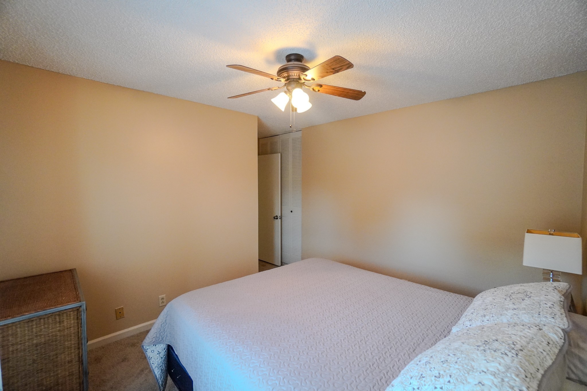 4000 Anderson Road, Unit 44 Nashville, TN 37217 - Photo 59 of 78 a bedroom with a bed and a chandelier