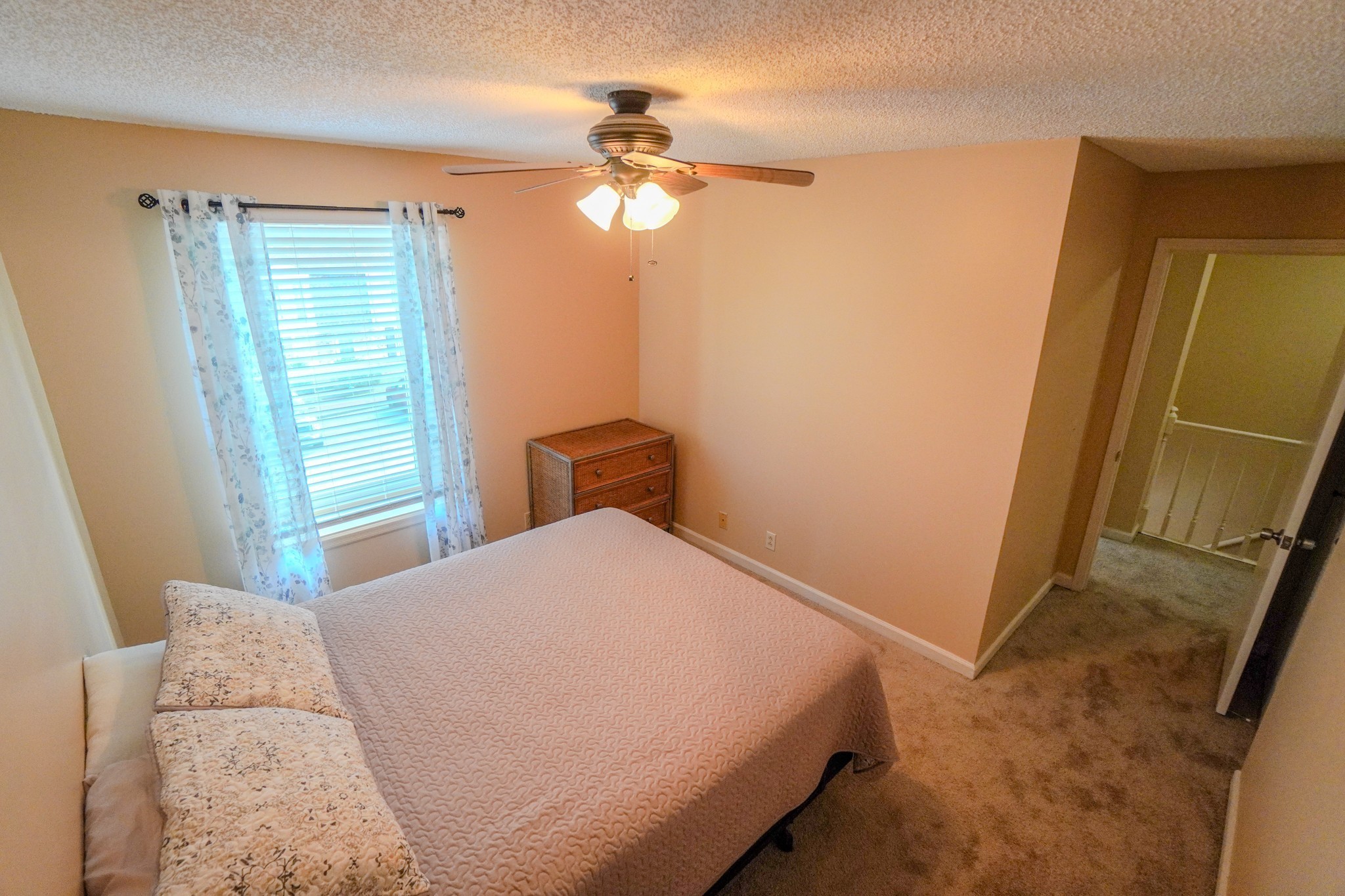 4000 Anderson Road, Unit 44 Nashville, TN 37217 - Photo 63 of 78 a bedroom with a bed and a chandelier