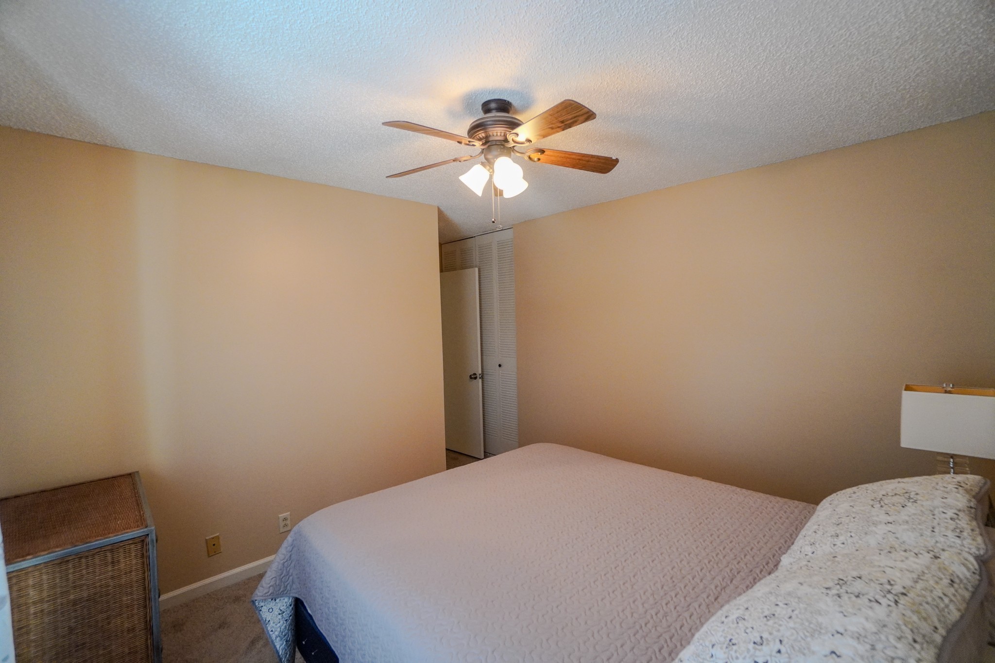 4000 Anderson Road, Unit 44 Nashville, TN 37217 - Photo 64 of 78 a bedroom with a bed and a chandelier