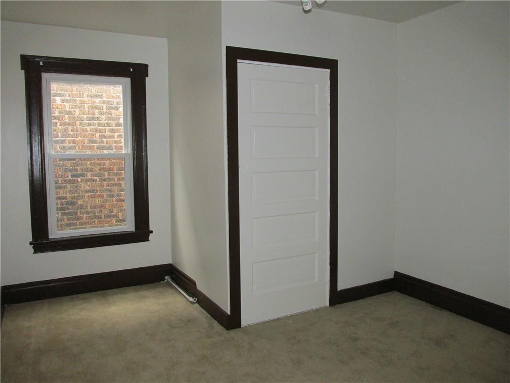 607 Gettysburg Street Pittsburgh, PA 15206 - Photo 9 of 13 an empty room with a window