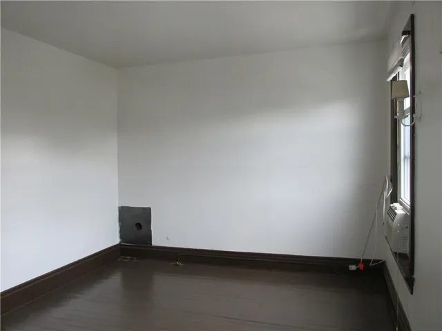 an empty room with a bench