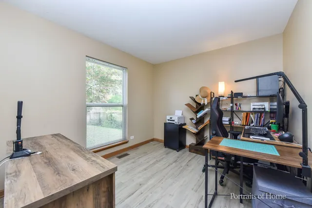 a workspace with furniture and window