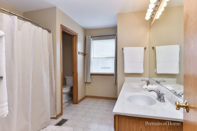a bathroom with a sink a mirror and a shower
