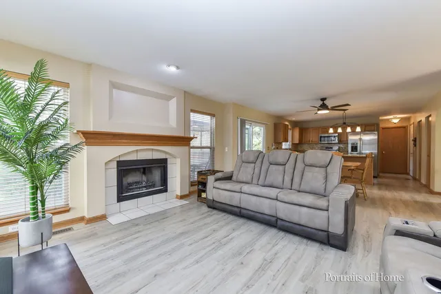 a living room with furniture and a fireplace