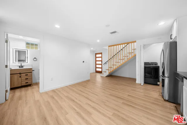 a view of a livingroom with wooden floor