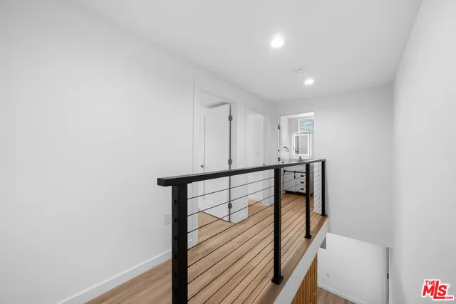 a view of an entryway with wooden floor