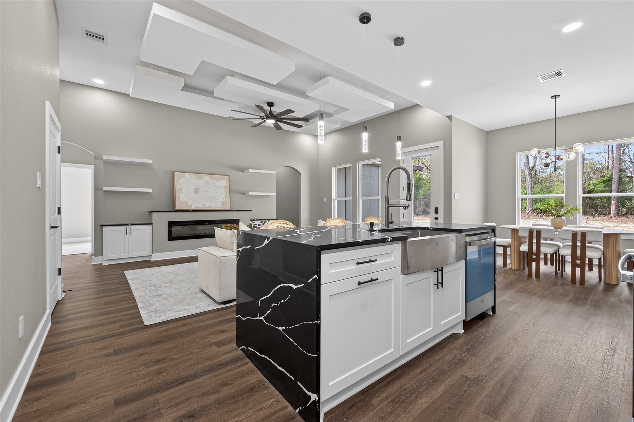 265 County Road 3376 Cleveland, TX 77327 - Photo 14 of 38 a view of kitchen with cabinets and wooden floor