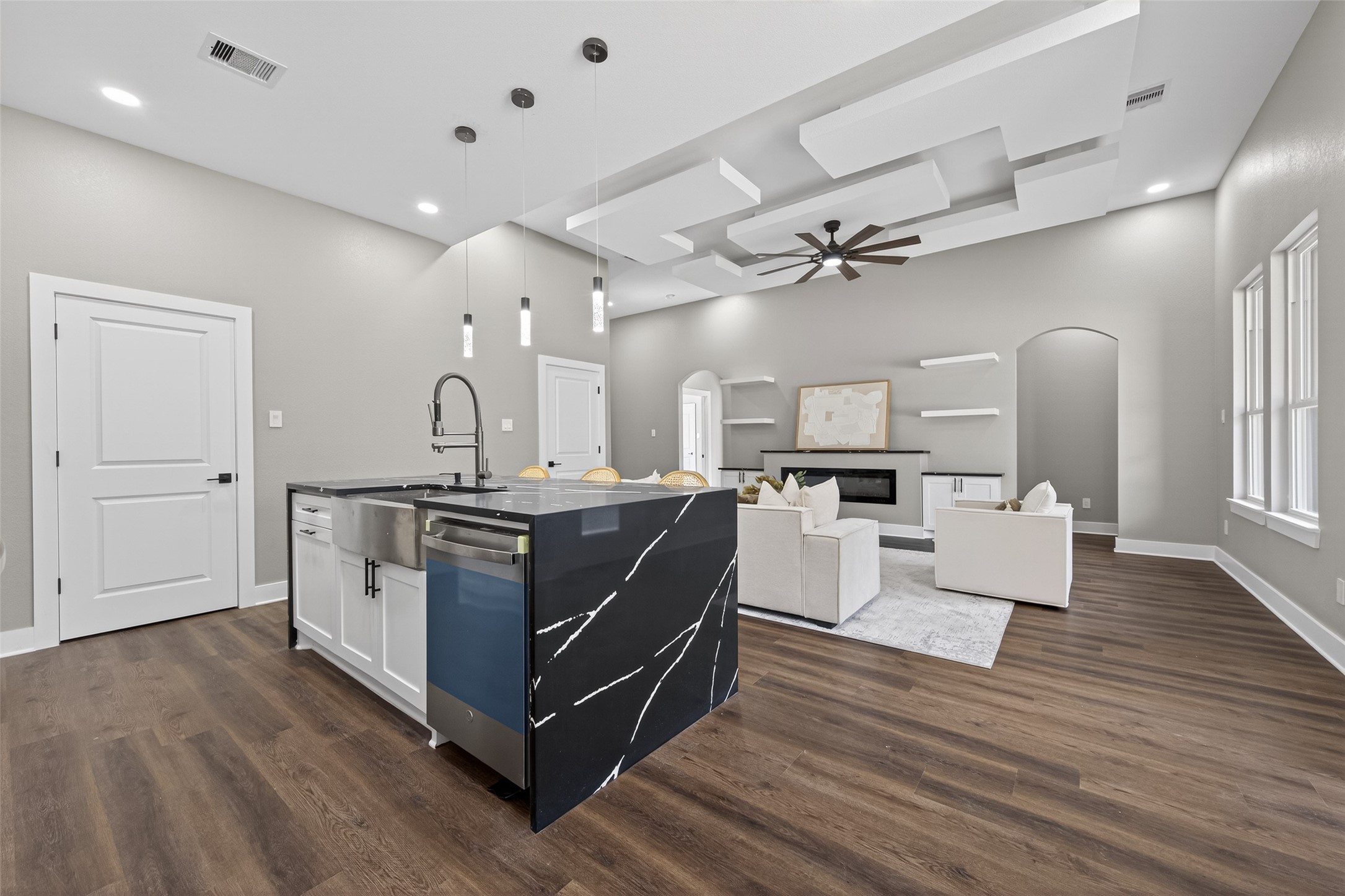 265 County Road 3376 Cleveland, TX 77327 - Photo 15 of 38 a kitchen with stainless steel appliances kitchen island hardwood floor sink and stove