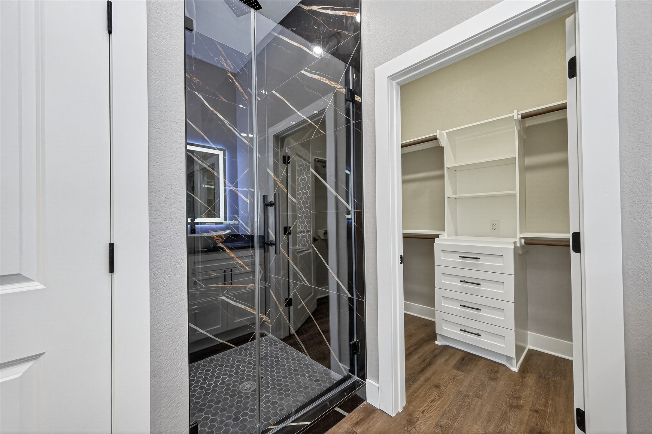 265 County Road 3376 Cleveland, TX 77327 - Photo 21 of 38 a view of walk in closet with clothes and shoes