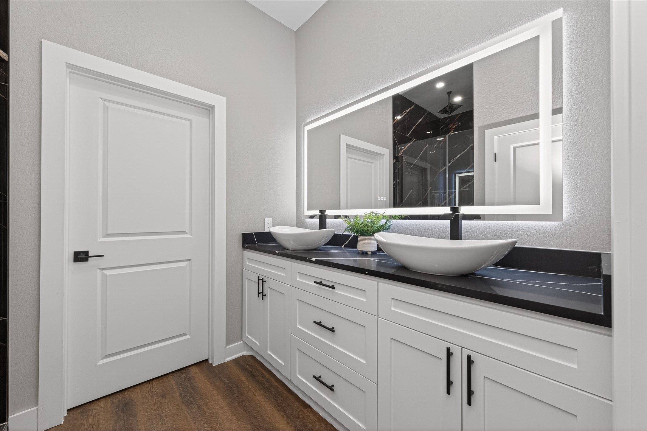 265 County Road 3376 Cleveland, TX 77327 - Photo 23 of 38 a bathroom with a granite countertop sink and a mirror