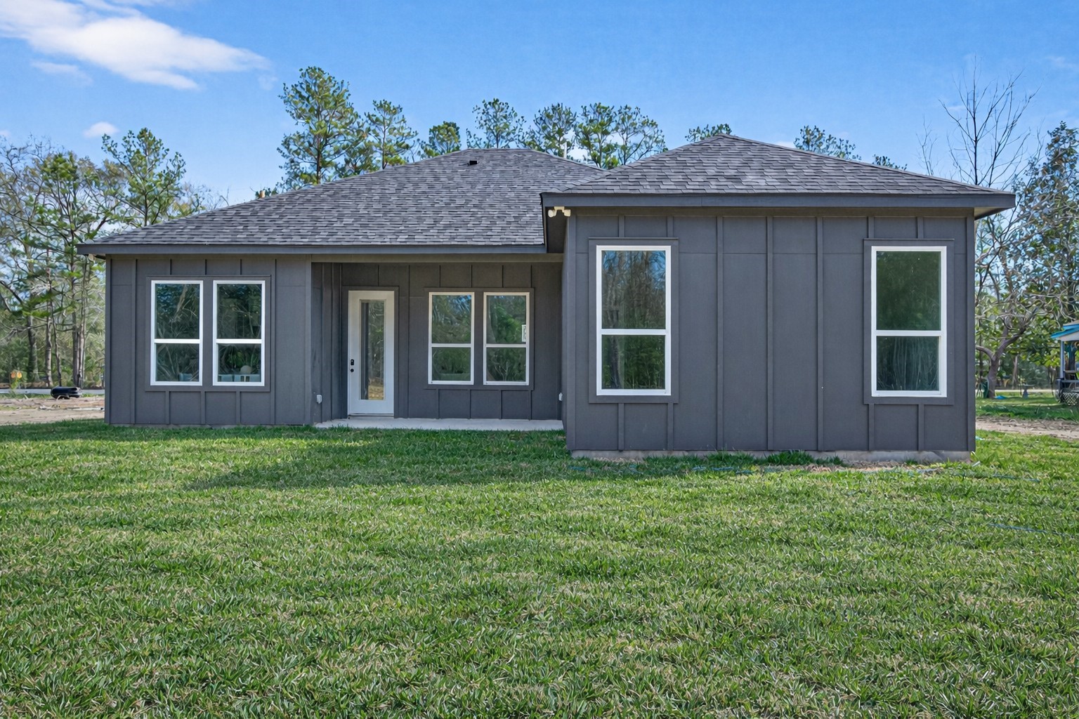265 County Road 3376 Cleveland, TX 77327 - Photo 36 of 38 a view of a house with a yard