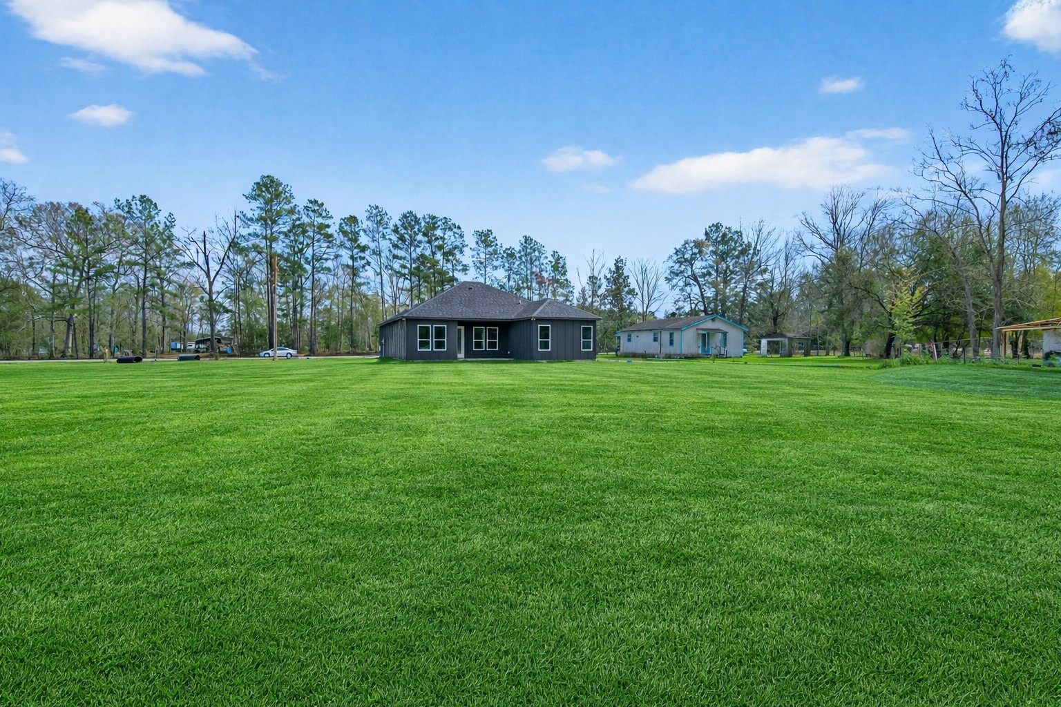 265 County Road 3376 Cleveland, TX 77327 - Photo 38 of 38 a view of a house with a big yard