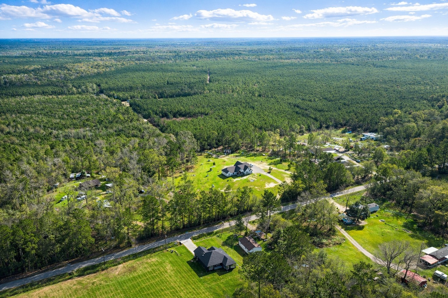 265 County Road 3376 Cleveland, TX 77327 - Photo 5 of 38 a view of a garden with an outdoor space