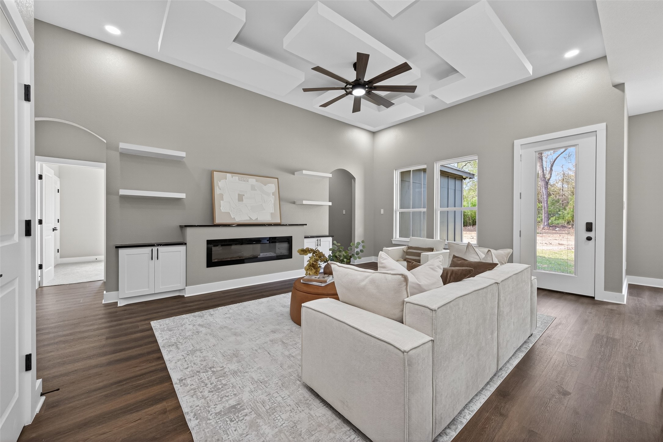 265 County Road 3376 Cleveland, TX 77327 - Photo 7 of 38 a living room with furniture and a chandelier