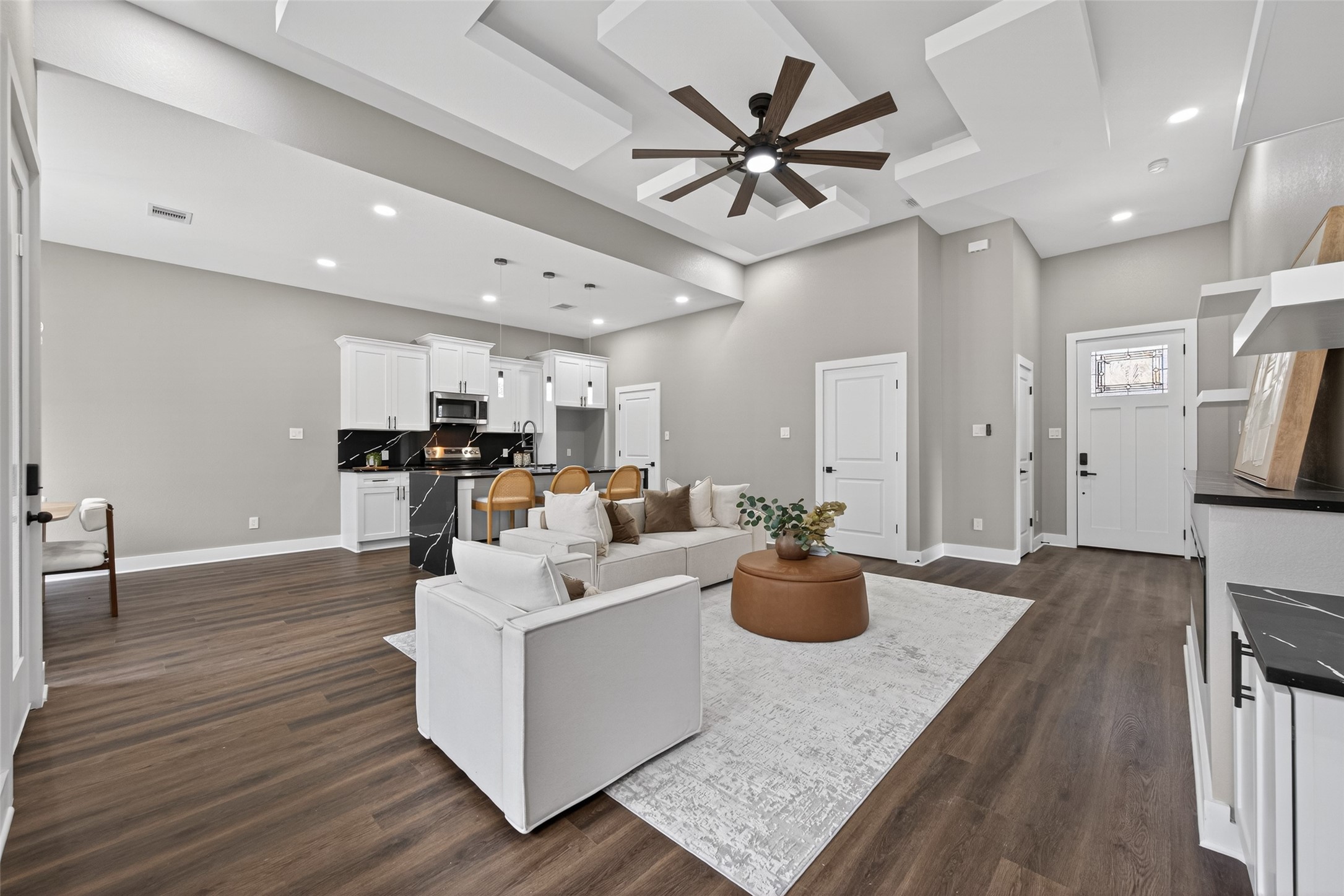 265 County Road 3376 Cleveland, TX 77327 - Photo 8 of 38 a living room with furniture kitchen view and a wooden floor