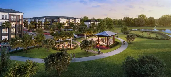 a kitchen with stainless steel appliances kitchen island granite countertop a stove a sink a refrigerator a center island a stove and a cabinets