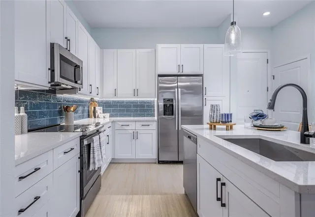 a living room with furniture and a lamp