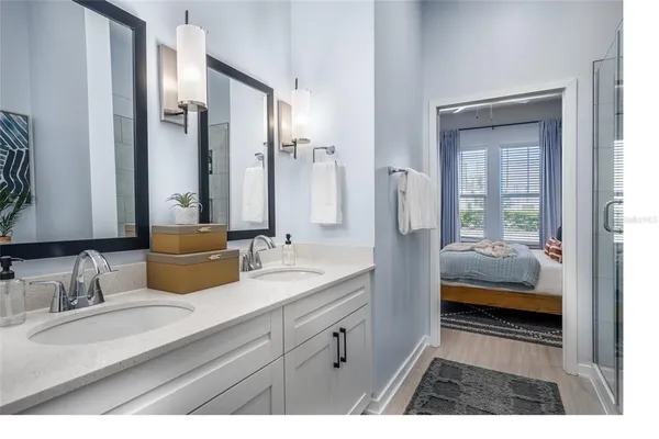 a bathroom with a sink and a shower curtain