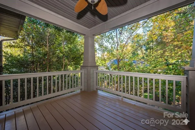 a view of balcony with wooden floor