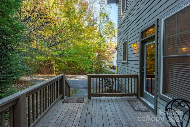 a view of deck with wooden floor and outdoor seating