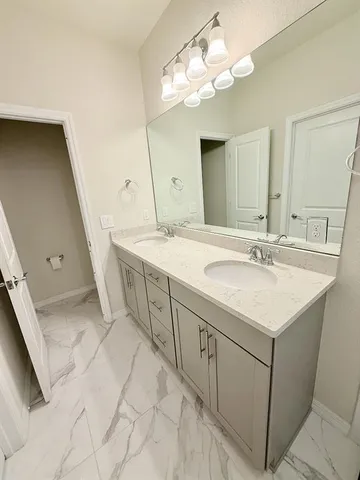 a bathroom with a sink and a shower