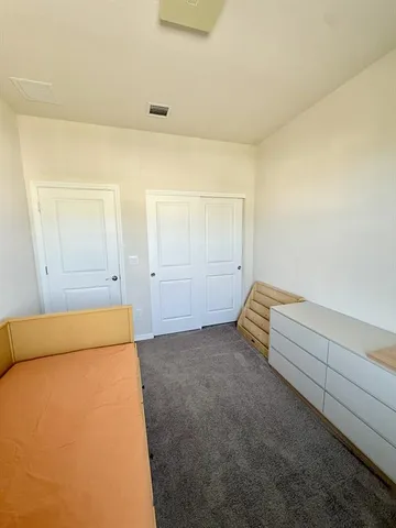 a room with furniture and flat screen tv