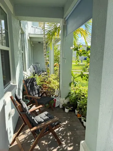 a view of a entryway with flower pots