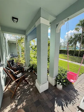 a view of a lobby with chair and flower garden