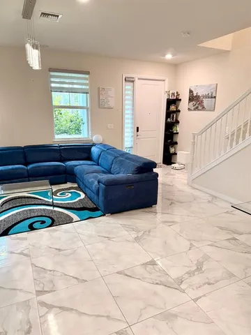 a bedroom with a bed and a couch