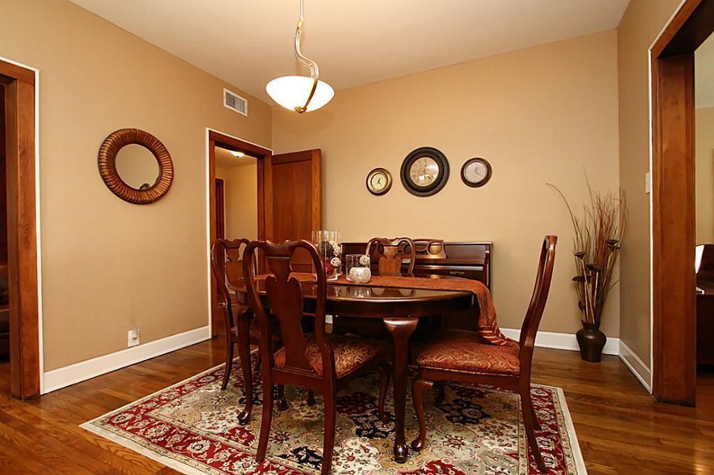 1915 Cleburne Street, Unit 1 Houston, TX 77004 - Photo 4 of 8 a view of a dining room with furniture and wooden floor