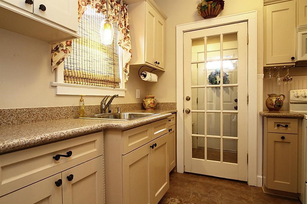 1915 Cleburne Street, Unit 1 Houston, TX 77004 - Photo 5 of 8 a bathroom with a granite countertop sink a mirror and a shower