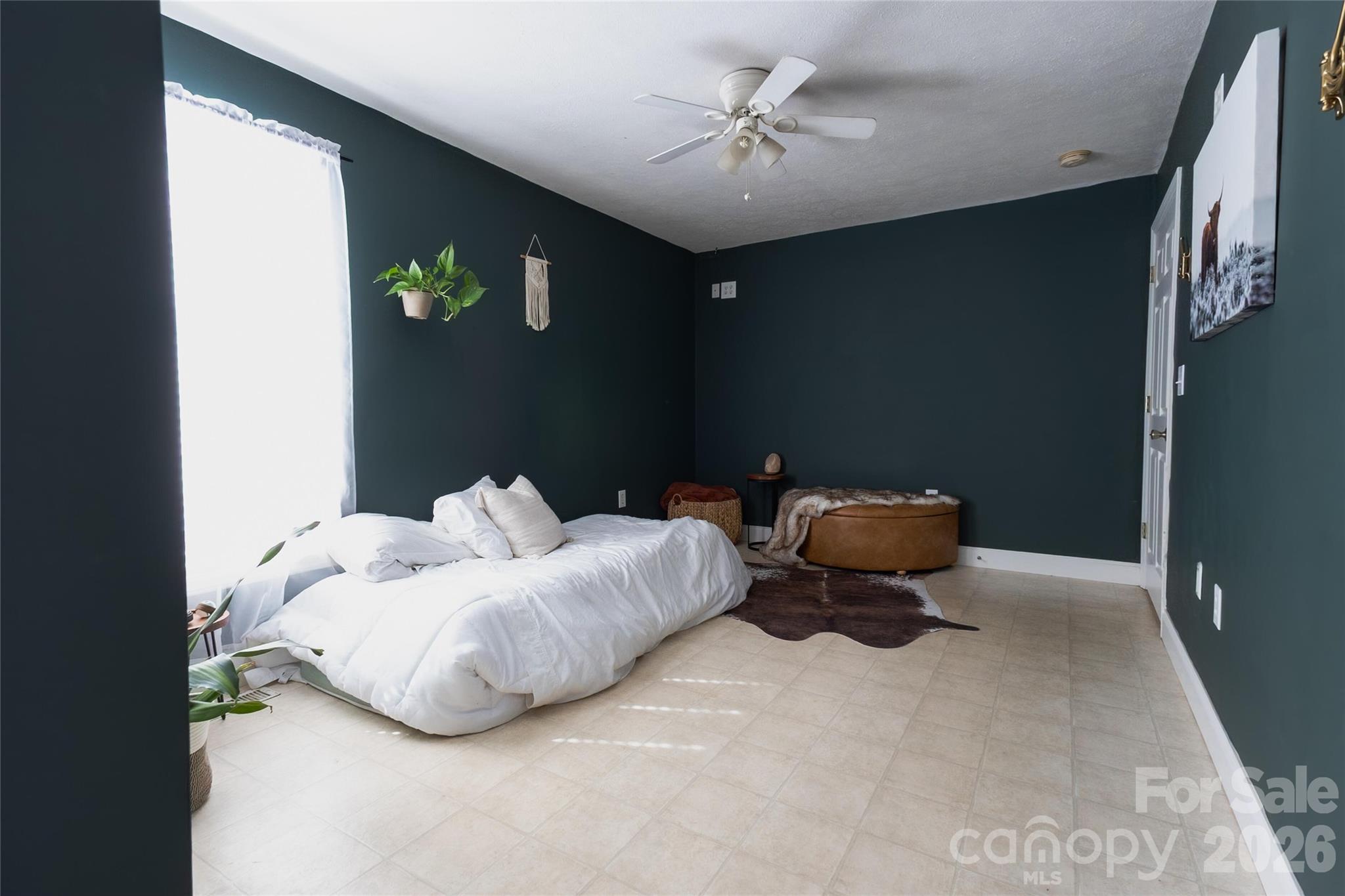 3780 Cook Road Valdese, NC 28690 - Photo 28 of 47 a bed room with a bed and a chandelier