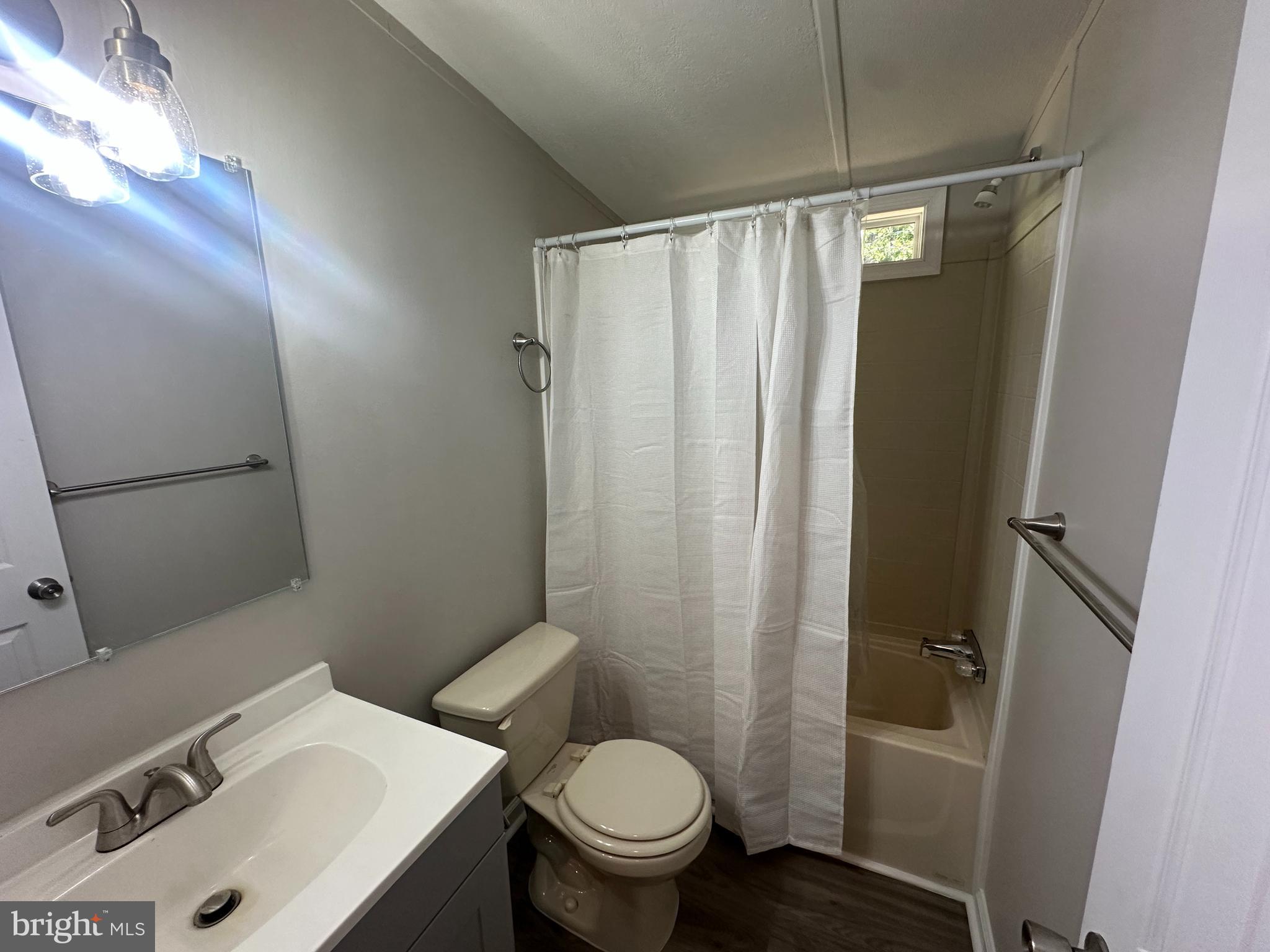 211 Maple Street Port Norris, NJ 08349 - Photo 11 of 28 a bathroom with a sink toilet and shower