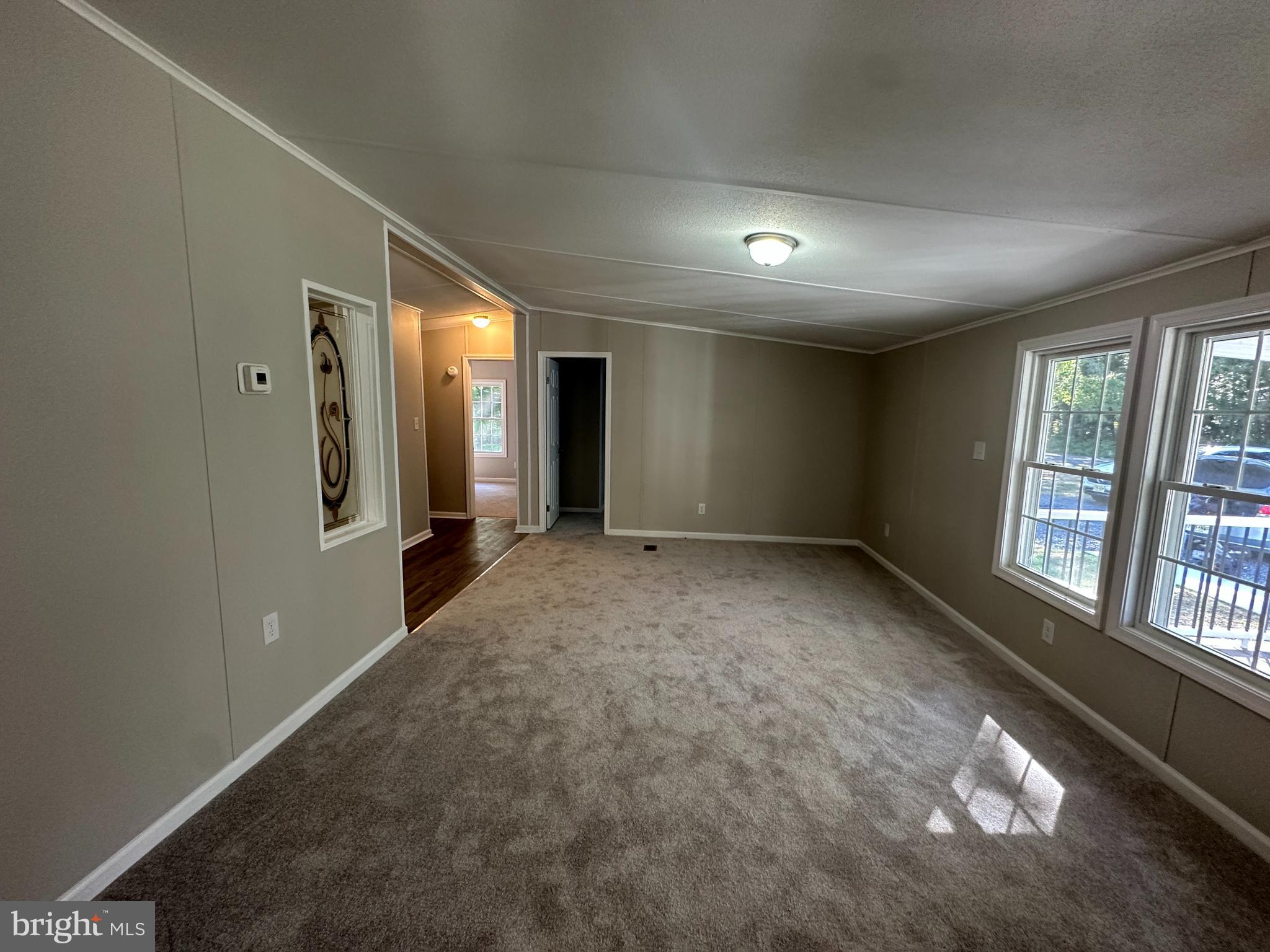 211 Maple Street Port Norris, NJ 08349 - Photo 15 of 28 wooden floor in an empty room with a window