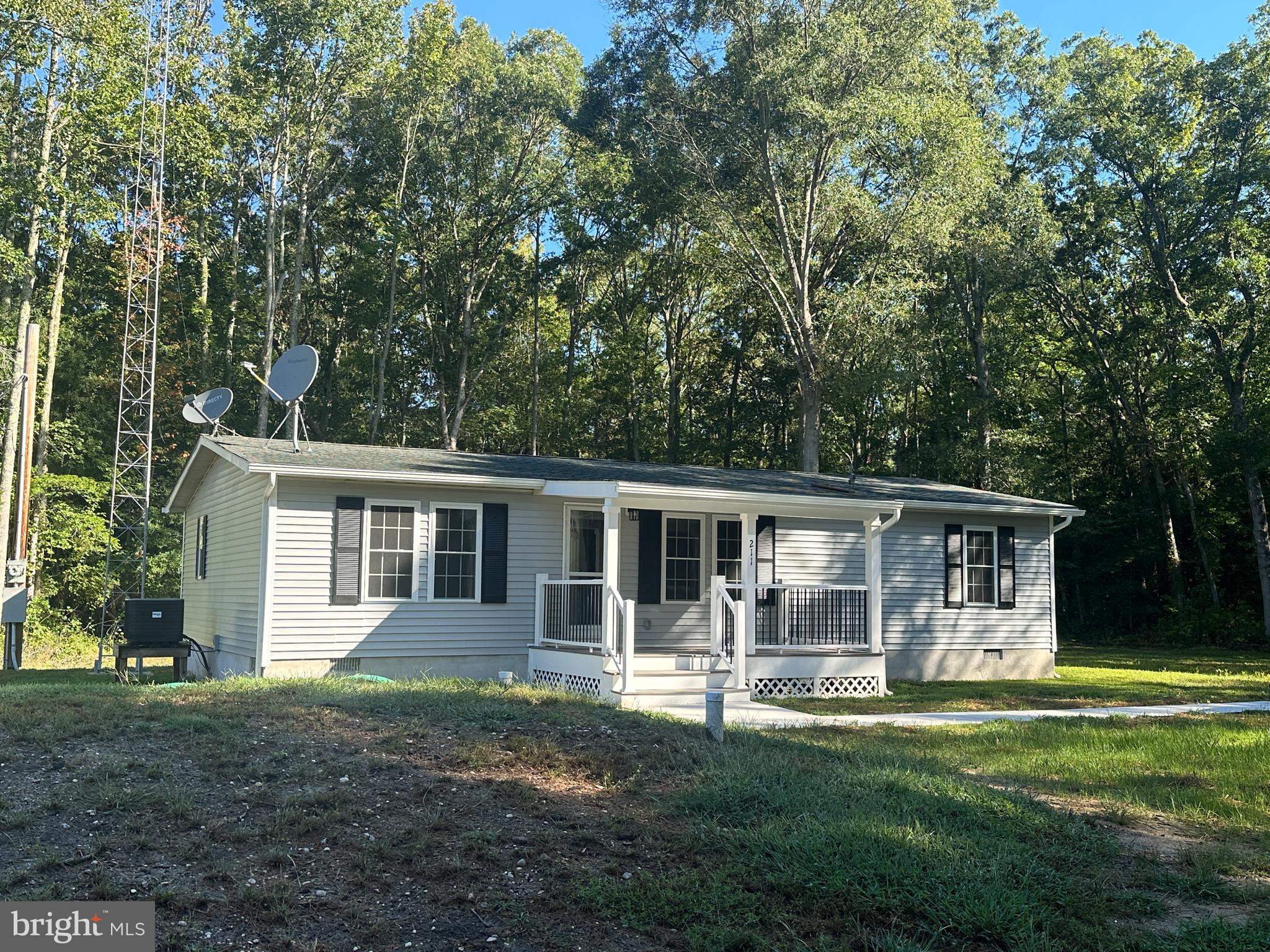211 Maple Street Port Norris, NJ 08349 - Photo 2 of 28 front view of a house with a yard