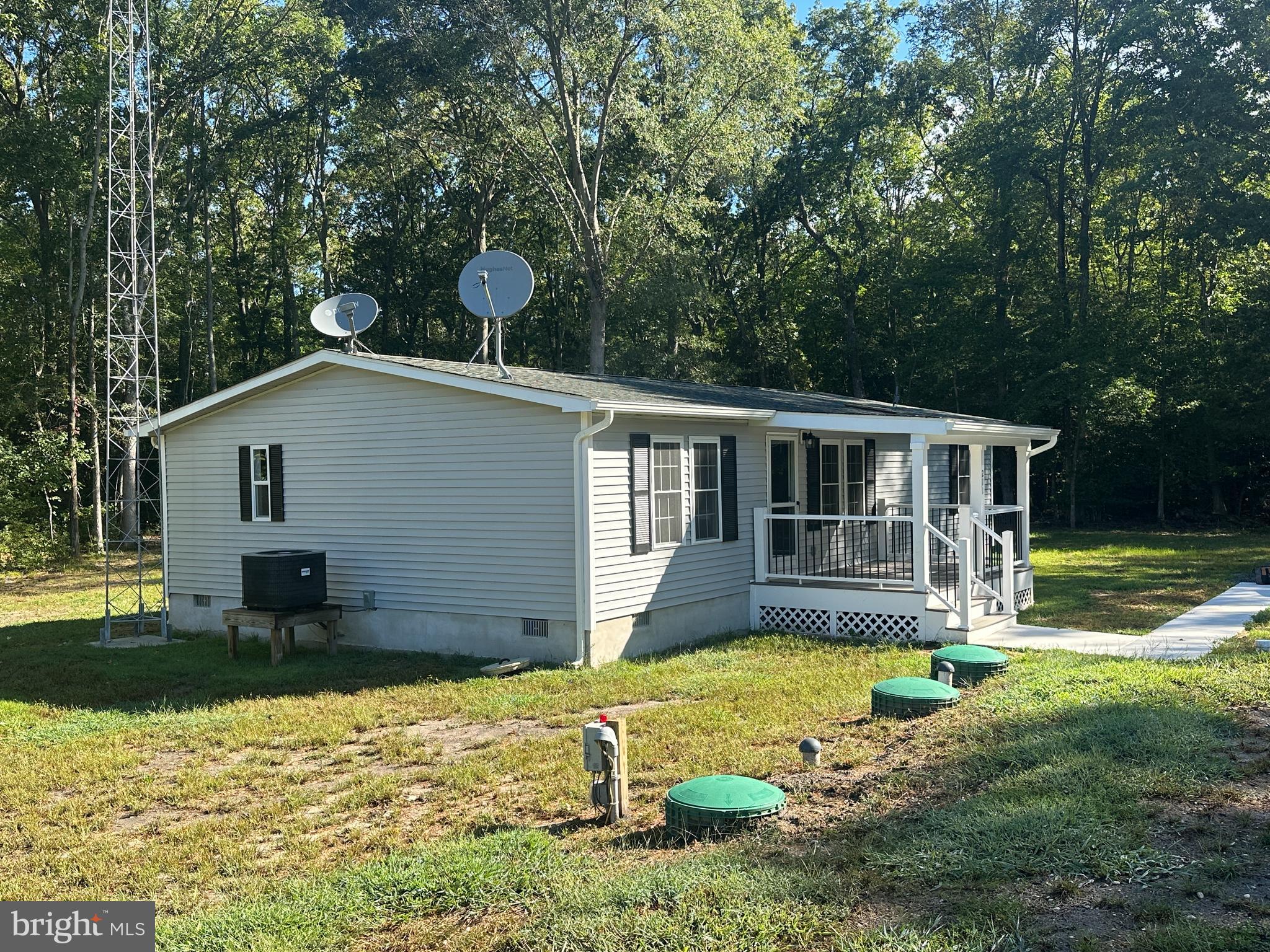 211 Maple Street Port Norris, NJ 08349 - Photo 3 of 28 a view of a house with a yard and sitting area