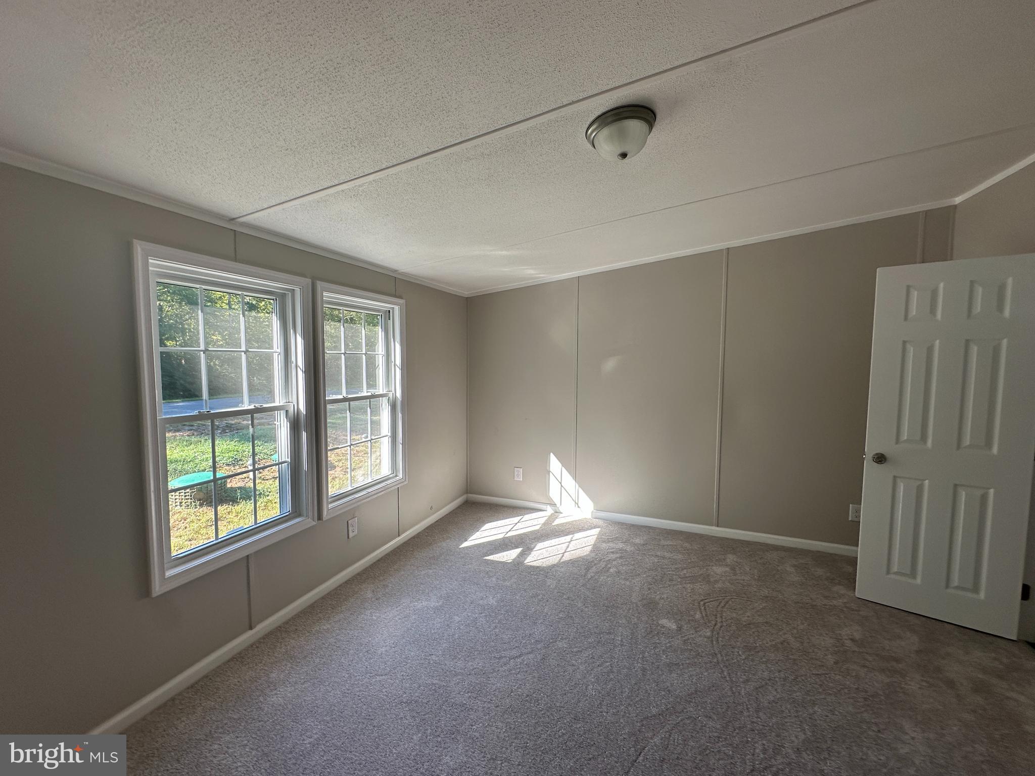 211 Maple Street Port Norris, NJ 08349 - Photo 5 of 28 a view of an empty room with a window
