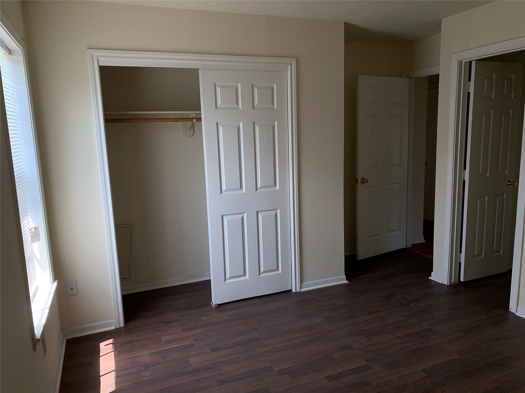 4310 College Main Street Bryan, TX 77801 - Photo 12 of 19 an empty room with wooden floor and closet