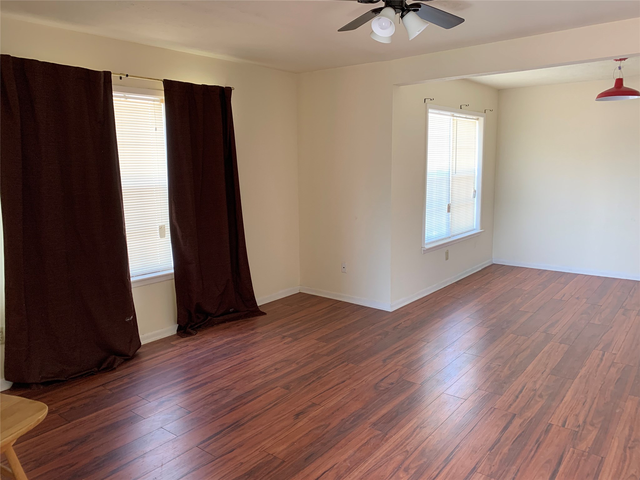 4310 College Main Street Bryan, TX 77801 - Photo 2 of 19 an empty room with wooden floor and a window