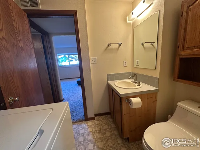 a view of a backyard with sitting area