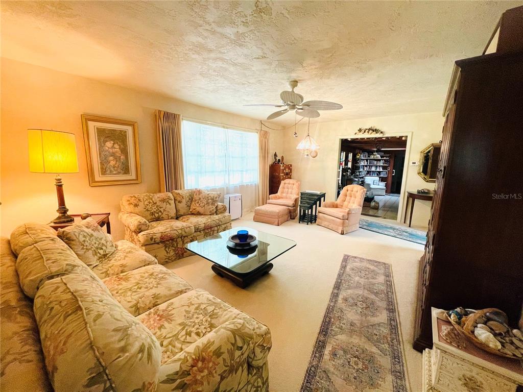 550 46th Street Sarasota, FL 34234 - Photo 11 of 48 a living room with furniture and a flat screen tv